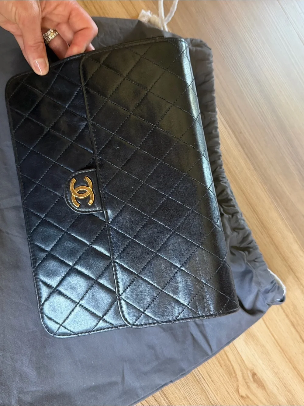 CHANEL Black Quilted Lambskin monoflap with Gold CC Emblem